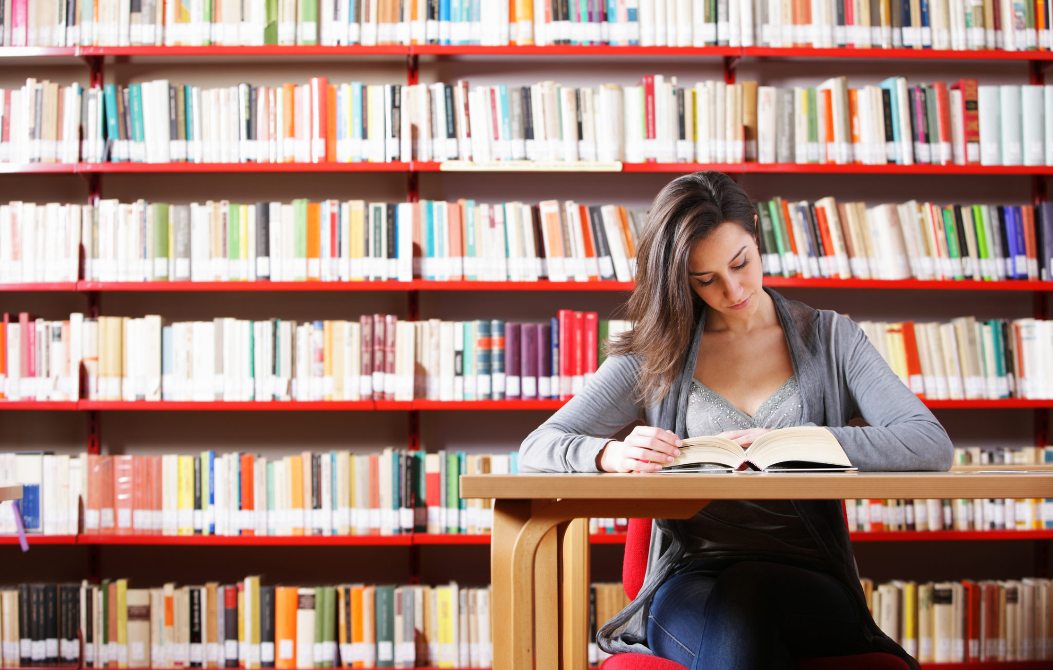 Portrait of a student girl studying at library - WorkLife Law